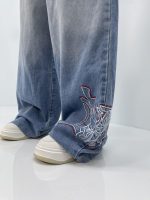 شلوار جین زنانه فول بگ آبی روشن گلدوزی مکس