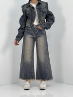 شلوار جین زنانه شافل قد نود آبی با سنگشور کرم قهوه ای