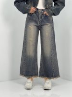 شلوار جین زنانه شافل قد نود آبی با سنگشور کرم قهوه ای