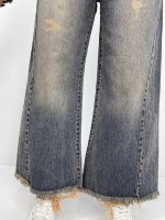 شلوار جین زنانه شافل قد نود آبی با سنگشور کرم قهوه ای