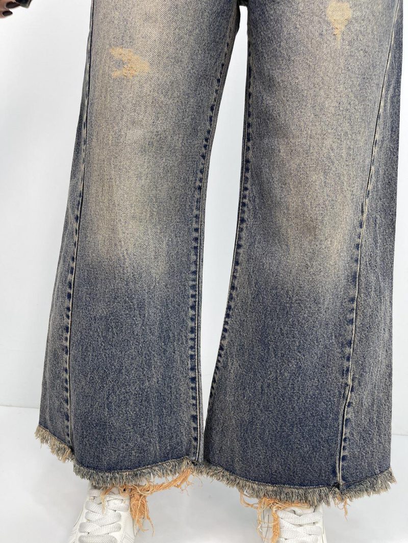 شلوار جین زنانه شافل قد نود آبی با سنگشور کرم قهوه ای