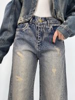 شلوار جین زنانه شافل قد نود آبی با سنگشور کرم قهوه ای
