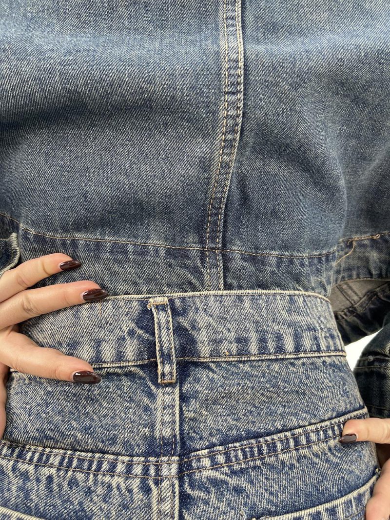 شلوار جین زنانه شافل قد نود آبی با سنگشور کرم قهوه ای