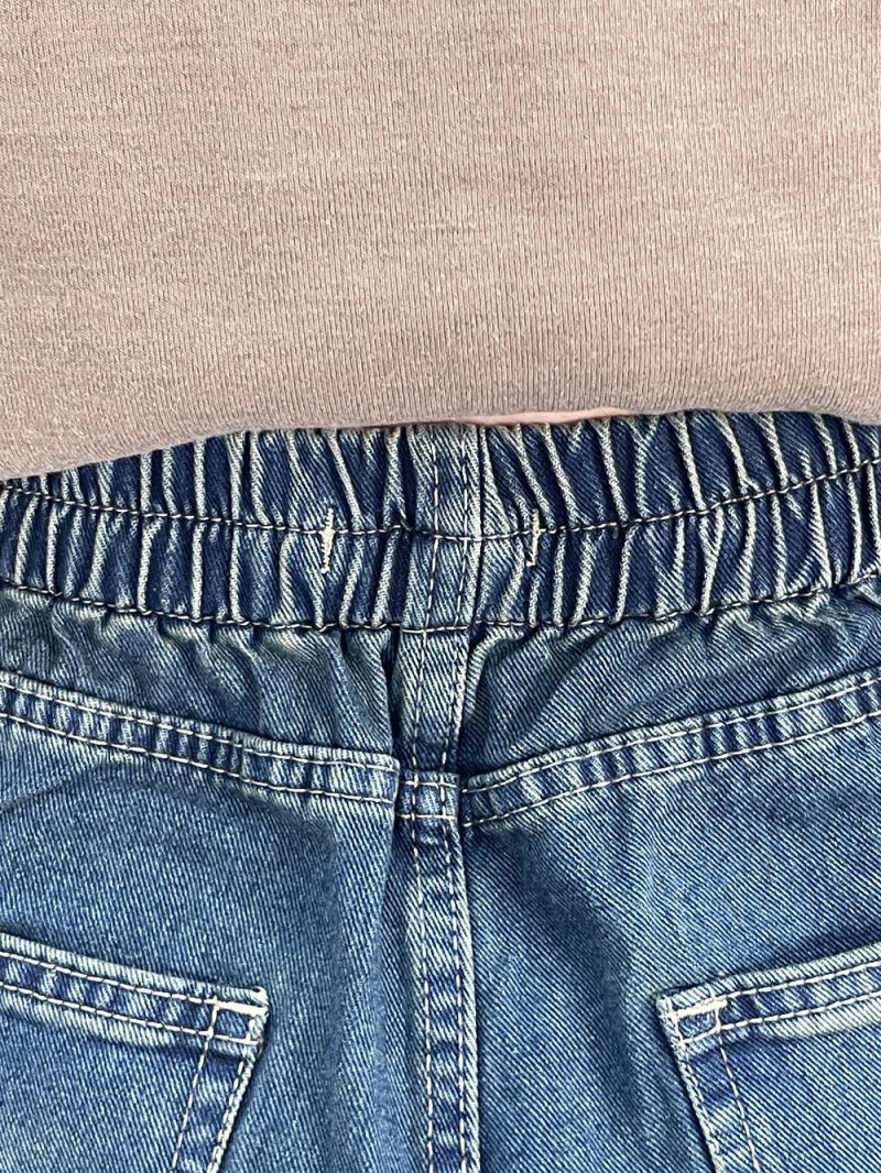 شلوار جین زنانه شافل آبی با سنگشور سبز سایز بزرگ