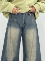 شلوار جین زنانه شافل سبز با سنگشور کرم