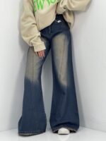 شلوار جین زنانه شافل سرمه ای با سنگشور کرم