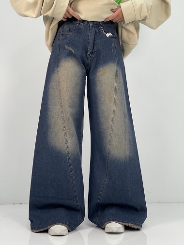 شلوار جین زنانه شافل سرمه ای با سنگشور کرم