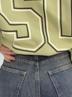 شلوار جین زنانه سرمه ای با سنگشور کرم